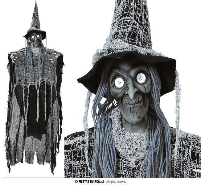 colgante de bruja con botones en los ojos